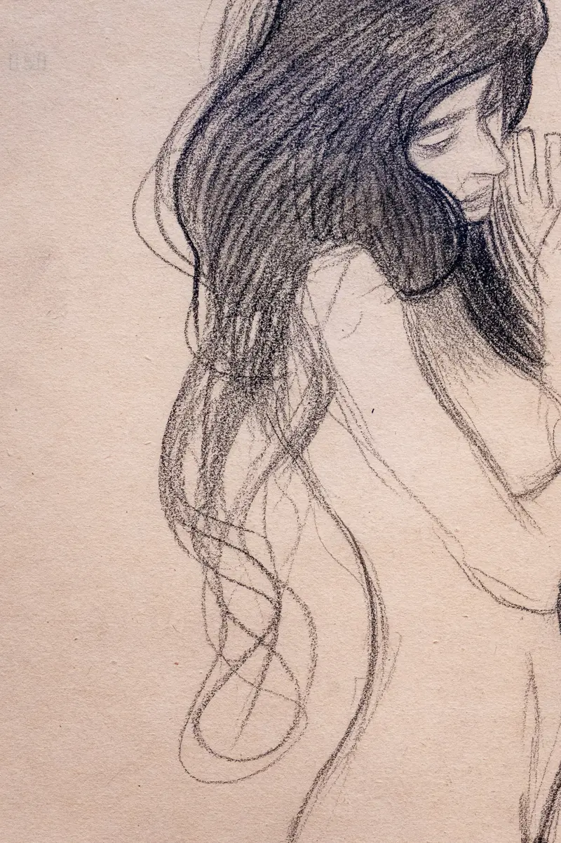 Contemplative Sketch of a Woman with Flowing Hair in Soft Graphite