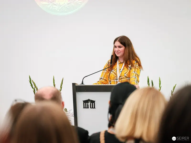 Elrea Song Presenting Award-Winning Photograph at Austrian Parliament Event