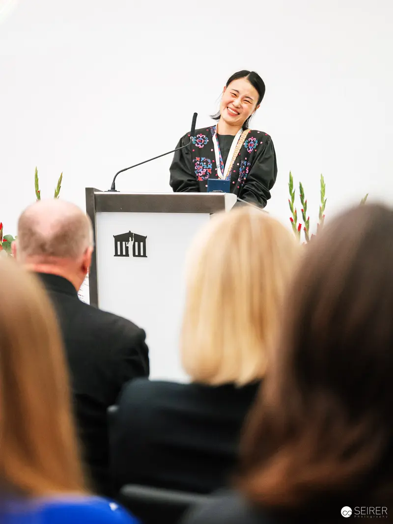 Elrea Song Presenting "Combing Peace" at Global Peace Photo Award 2023