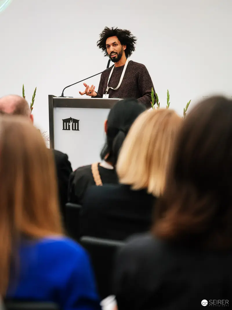 Ghassane Kaaibich Delivering Keynote at Global Peace Photo Award 2023 Ceremony