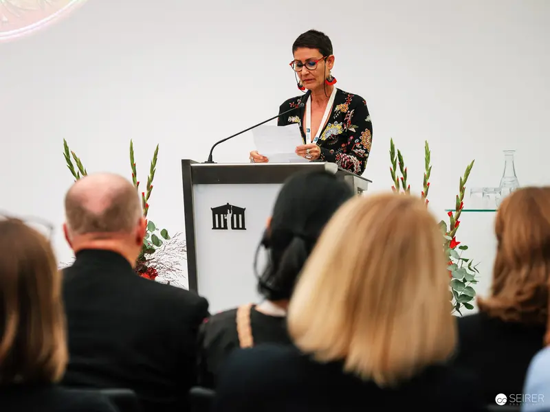 Elrea Song Presenting Award-Winning Photography at Austrian Parliament Event