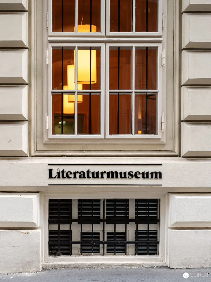Exterior View of Literaturmuseum with Illuminated Window Display