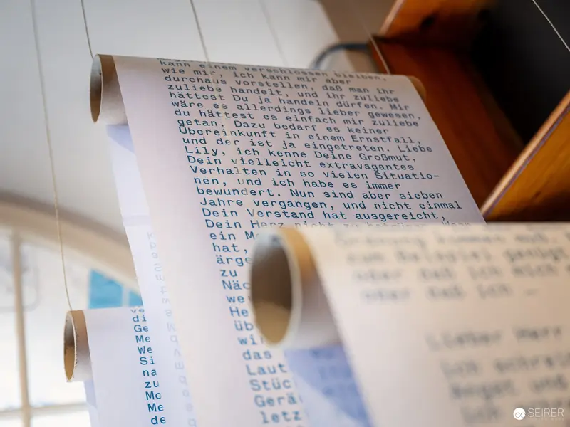 Textual Fragments: Detailed Manuscript Scroll in Scholarly Exhibition Setting