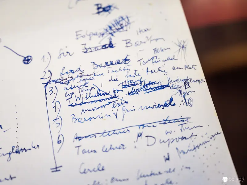 Handwritten Notes with Blue Pen on Archival Document