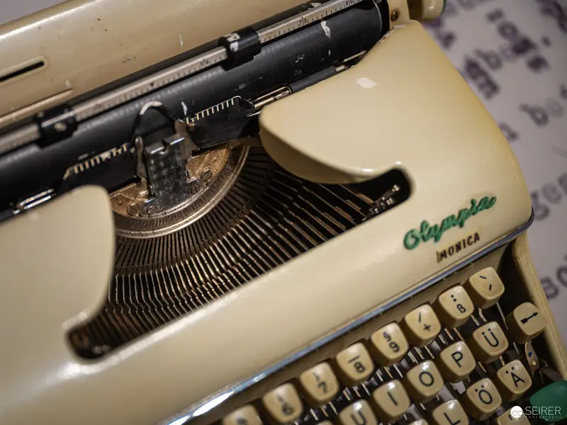 Vintage Olympia Monica Typewriter Close-Up with Detailed Keyboard