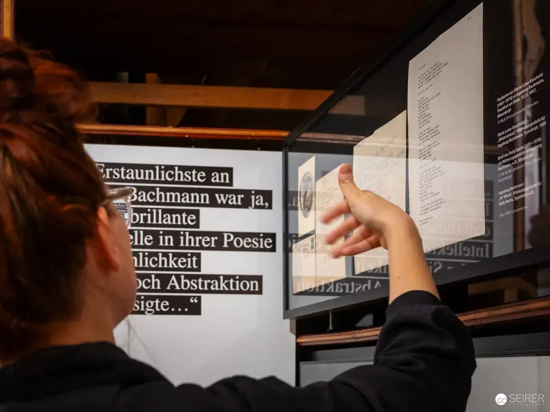 Visitor Examining Ingeborg Bachmann Exhibition Text at Literature Museum