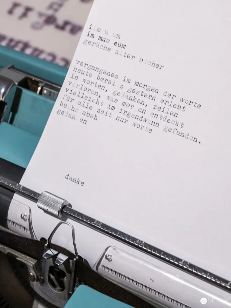Vintage Typewriter with Partially Typed German Manuscript Page