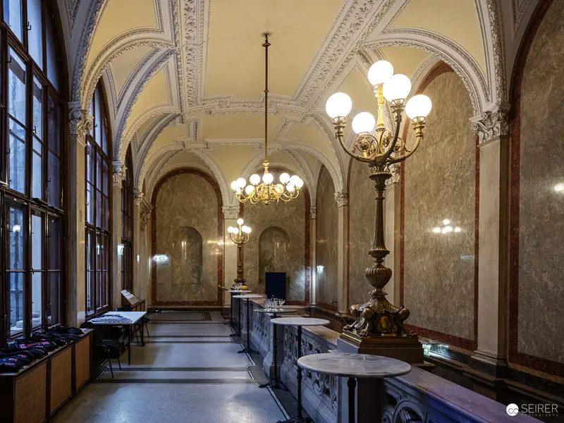Ornate Viennese Interior with Baroque Chandeliers and Arched Ceiling