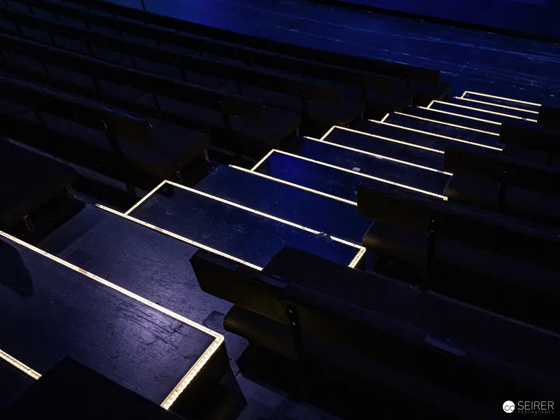Illuminated Solar Panels Creating Geometric Light Pattern in Nighttime Setting