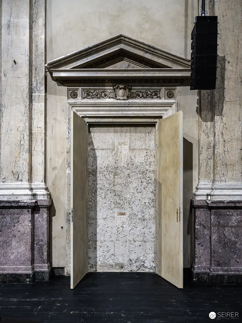 Architectural Doorway with Neoclassical Pediment in Aged Interior Setting