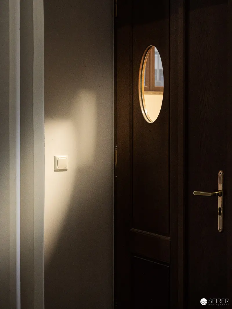 Luminous Interior Study with Door and Light Projection