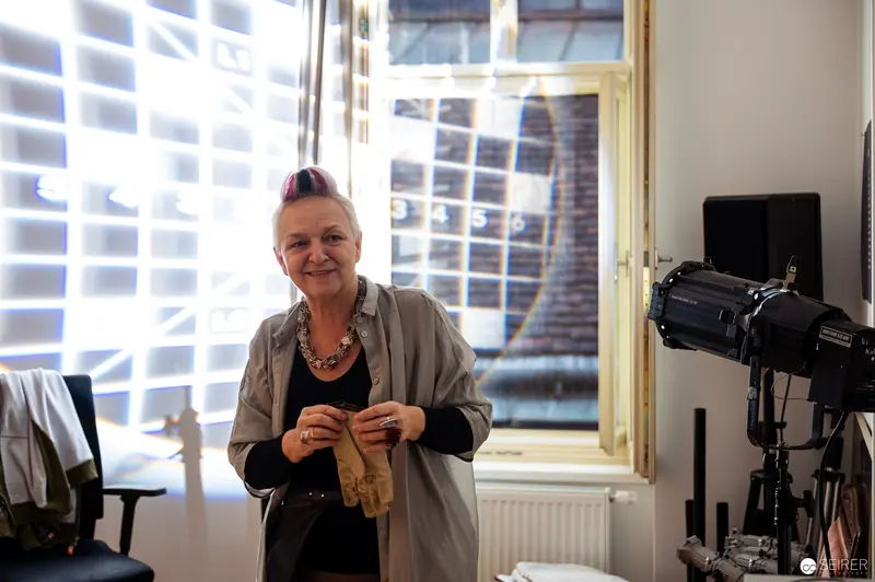 Studio Portrait of Artisan Knitting by Studio Lighting and Window