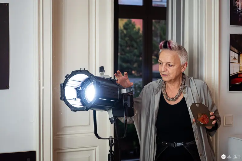 Studio Lighting Technician Adjusting Professional Photography Spotlight