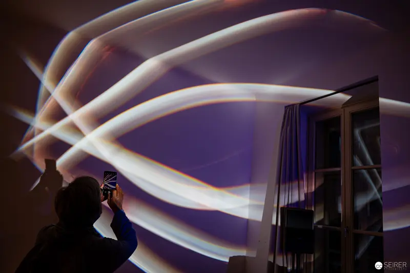 Light Painting Silhouette: Photographer Creates Luminous Arcs in Interior Space