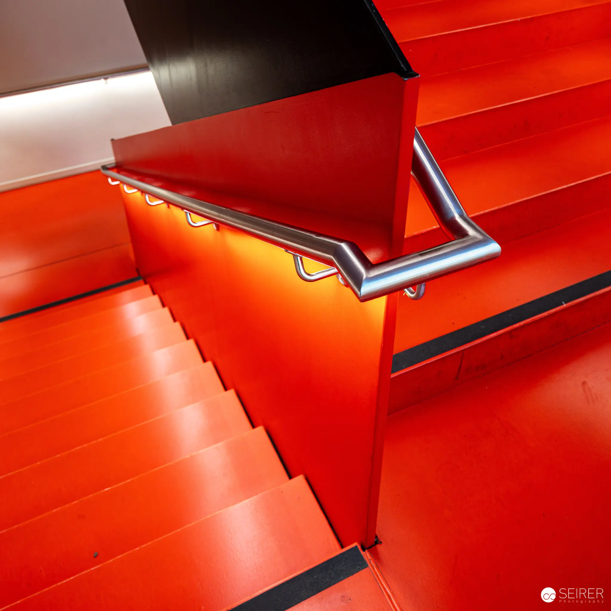 Orange staircase at Albertina Modern during "Österreich – Deutschland. Malerei 1970–2020"