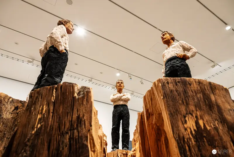 Painted wooden figure sculptures on tree-trunk plinths, Albertina Modern Vienna 2023