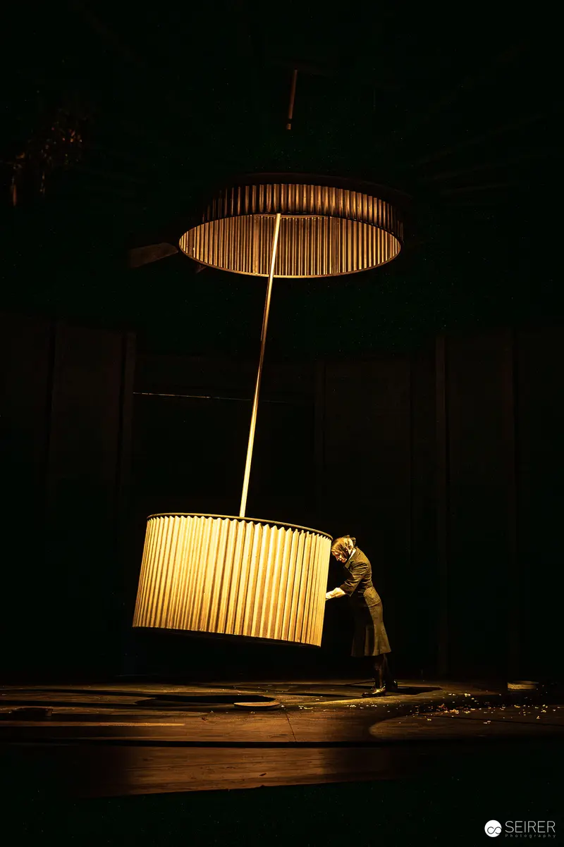 Actor with Oversized Illuminated Lampshades in "Bis nächsten Freitag" at Theater in der Josefstadt