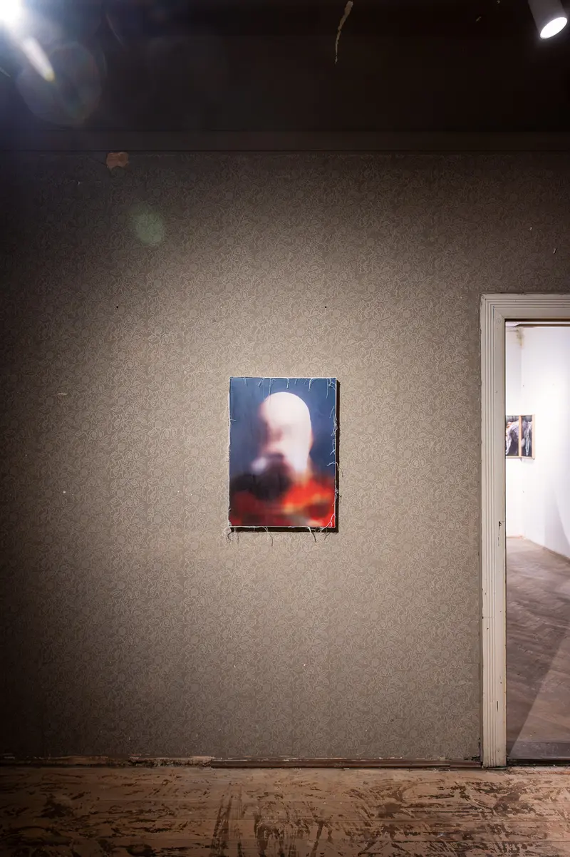 Blurred Portrait in Gallery Setting with Soft Illumination and Architectural Frame