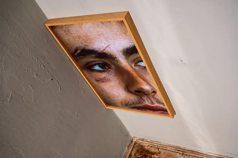 Fractured Self-Portrait: Triangular Reflection of Intense Gaze