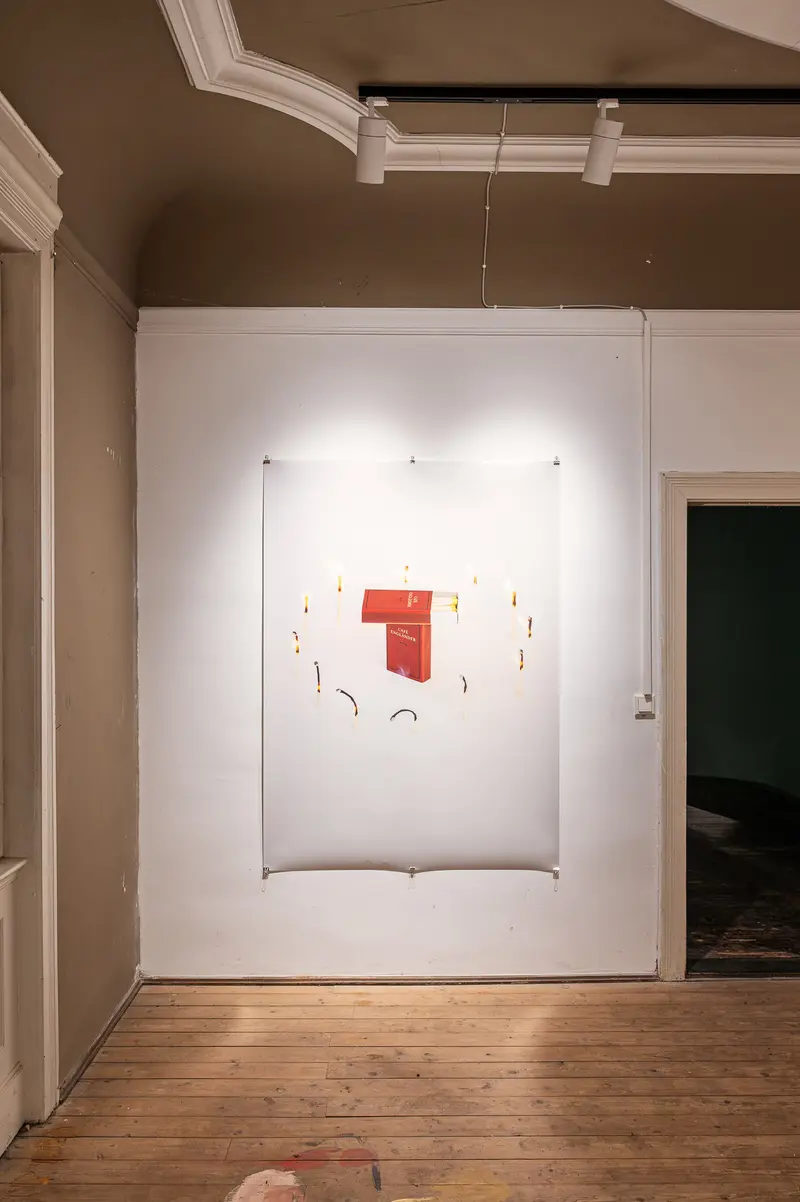 Minimalist Red Art Installation in White Gallery Space with Wooden Floors