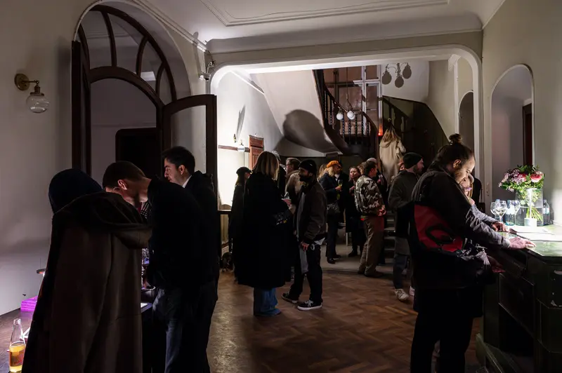 Stefanie Moshammer's Exhibition Opening: Intimate Gallery Gathering in Subdued Lighting