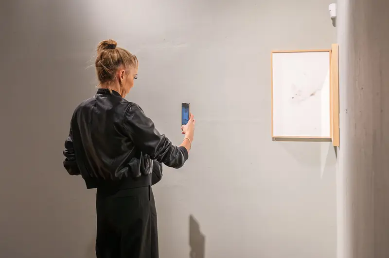 Stefanie Moshammer Photographing Artwork during "A Fountain Playing In The Sun" Exhibition Opening