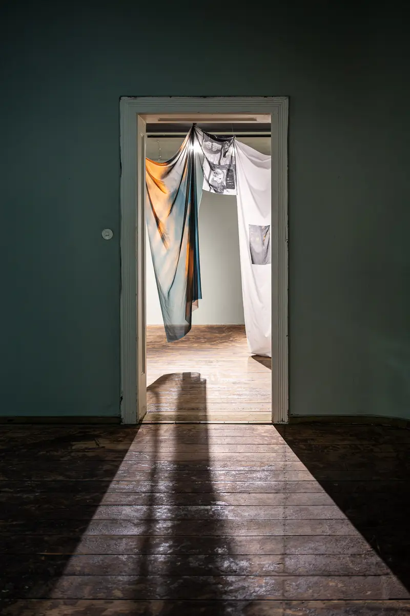 Draped Fabric and Shadows: Interior Passage Through Doorway
