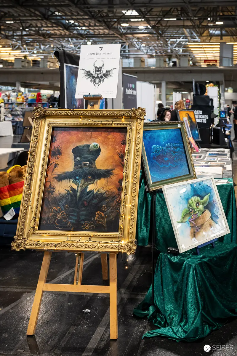 Framed Fantasy Art Displays at Comic Convention Showcase Imaginative Artwork