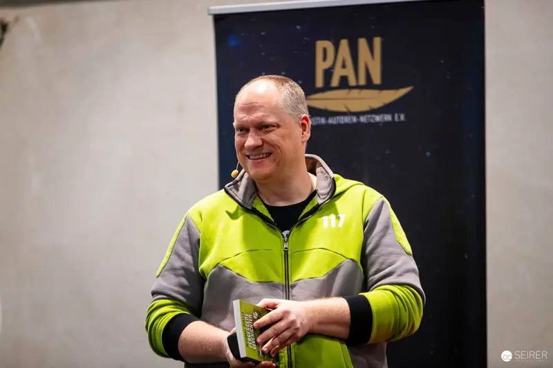 PAN Event Staff Member in High-Visibility Safety Vest Smiling