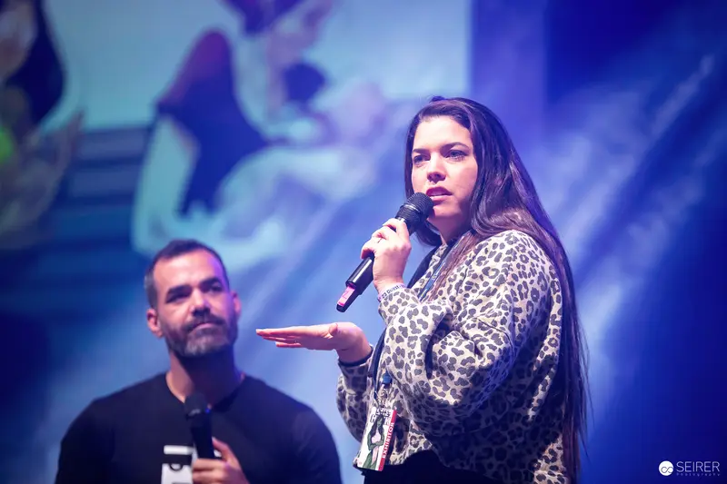 Vienna ComicCon 2023: Performers on Stage with Microphones and Dynamic Lighting