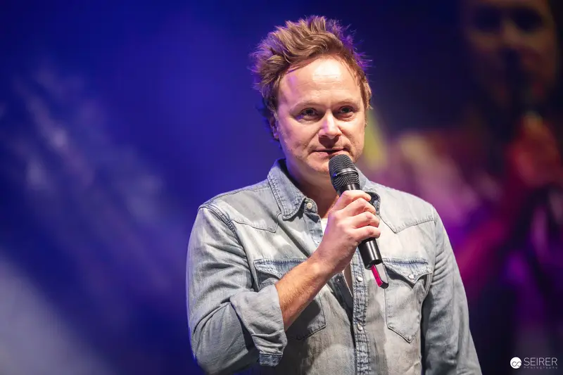 Stand-up Comedian Performing with Microphone at Vienna ComicCon 2023