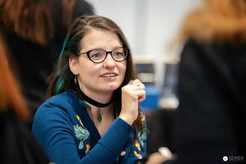 Engaged Participant at Vienna ComicCon 2023 in Blue Sweater