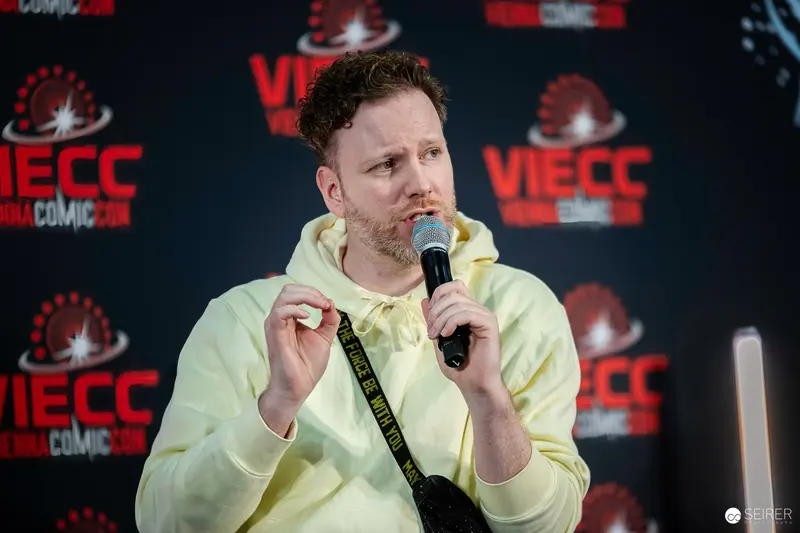 Seth Rogen Speaking at Vienna Comic Con 2023 in Pastel Yellow Hoodie