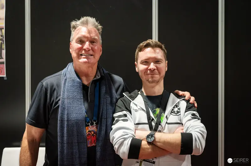 Two Generations at Vienna ComicCon 2023: Smiling Attendees Posing Together