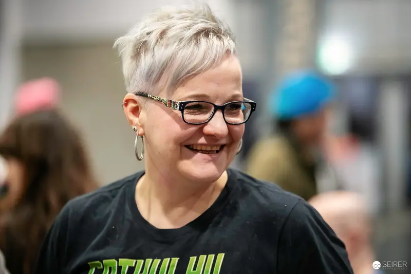 Smiling Comic Con Attendee in Black Cthulhu Shirt at VIECC 2023