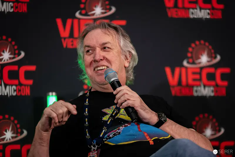 Panel Guest with Microphone Speaking on Stage at VIECC Vienna Comic Con 2023