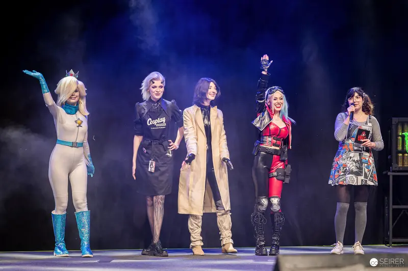 Cosplay contest finalists and host on stage at VIECC Vienna Comic Con 2023