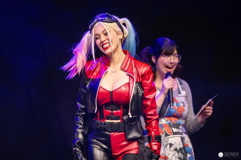 Harley Quinn Cosplayer on Stage with Host at VIECC Vienna Comic Con 2023