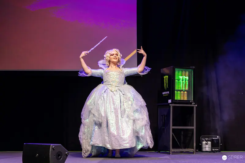 Fairy Godmother Cosplayer with Wand on VIECC Vienna Comic Con Stage