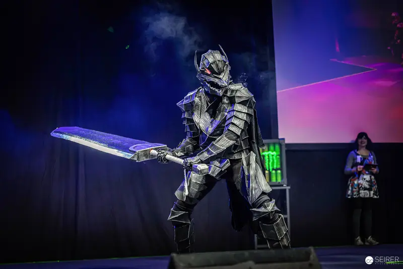 Armoured Cosplayer with Oversized Blade on Stage at VIECC Vienna Comic Con 2023