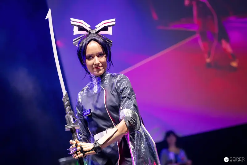 Cosplayer with Katana and Winged Headpiece on Stage at VIECC Vienna Comic Con 2023
