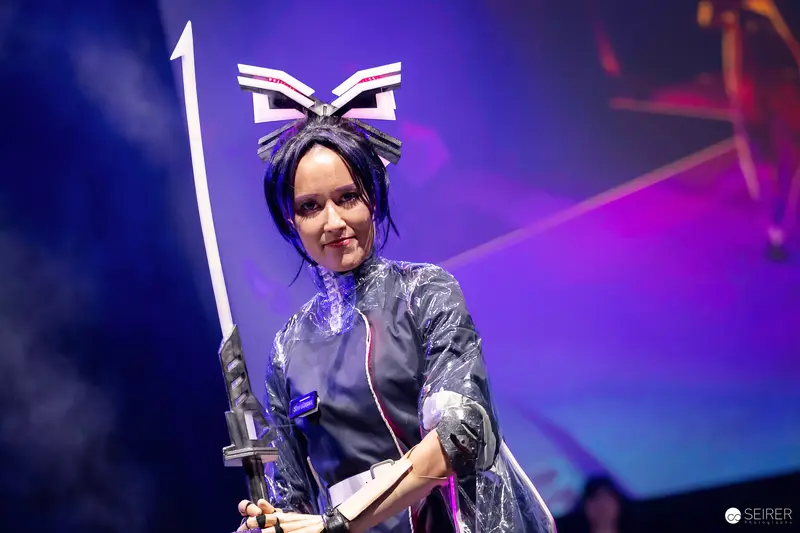 Cosplayer with Katana and Winged Headpiece on Stage at VIECC Vienna Comic Con 2023