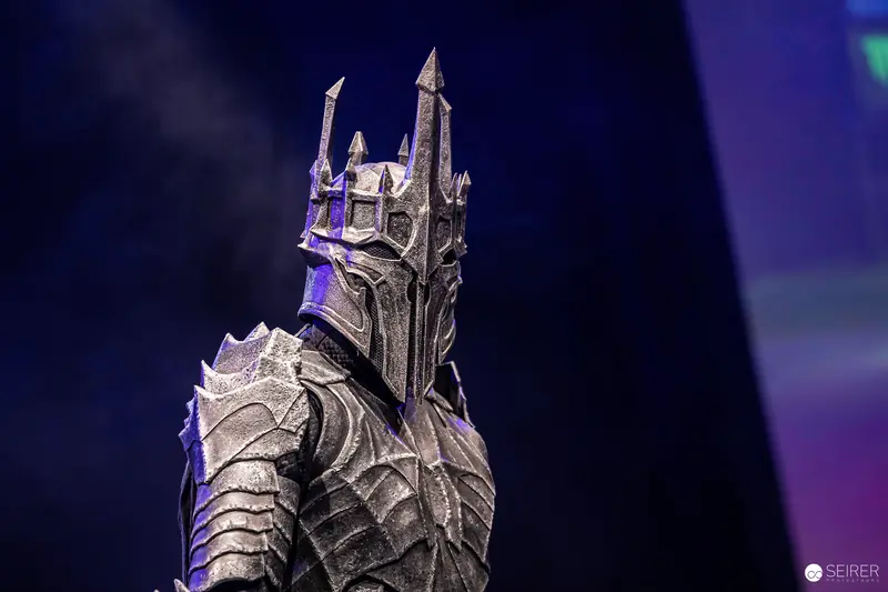 Sauron cosplay in spiked black armour and crowned helm at VIECC Vienna Comic Con 2023
