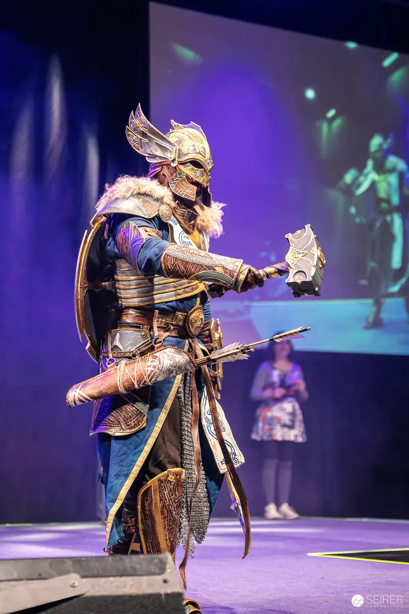 Winged-Helmet Warrior Cosplayer with War Hammer on VIECC Vienna Comic Con Stage