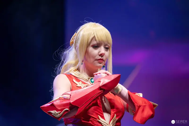 Cosplayer in Red and Gold Armour on Stage at VIECC Vienna Comic Con 2023