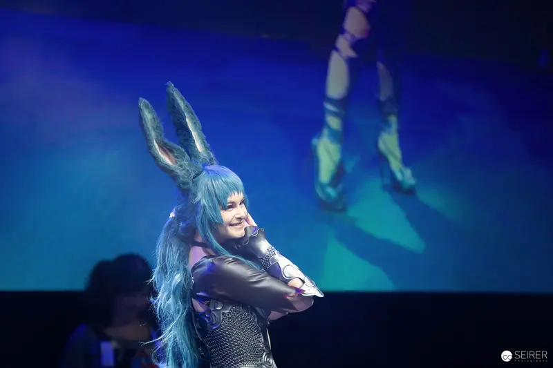 Cosplayer in blue-haired rabbit-eared costume onstage at VIECC Vienna Comic Con 2023