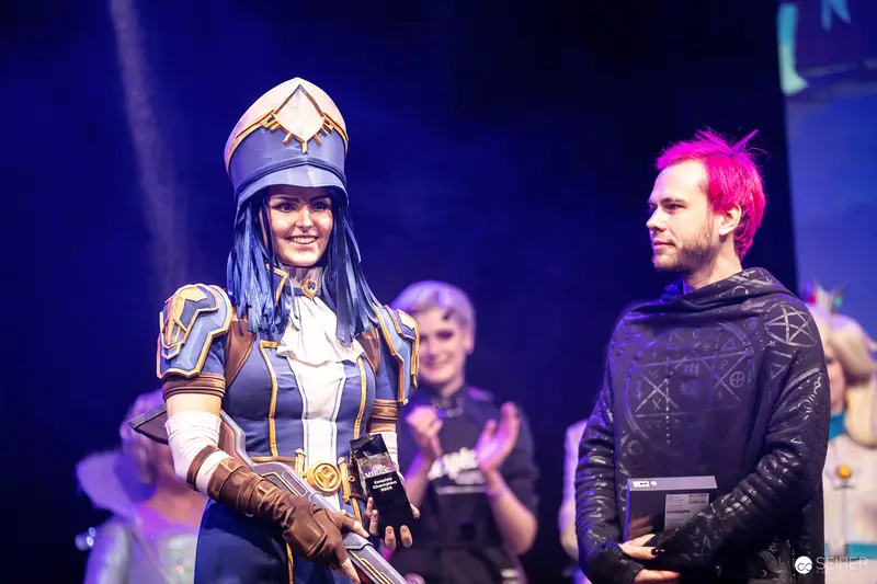 Cosplayers Holding Awards on Stage at VIECC Vienna Comic Con 2023