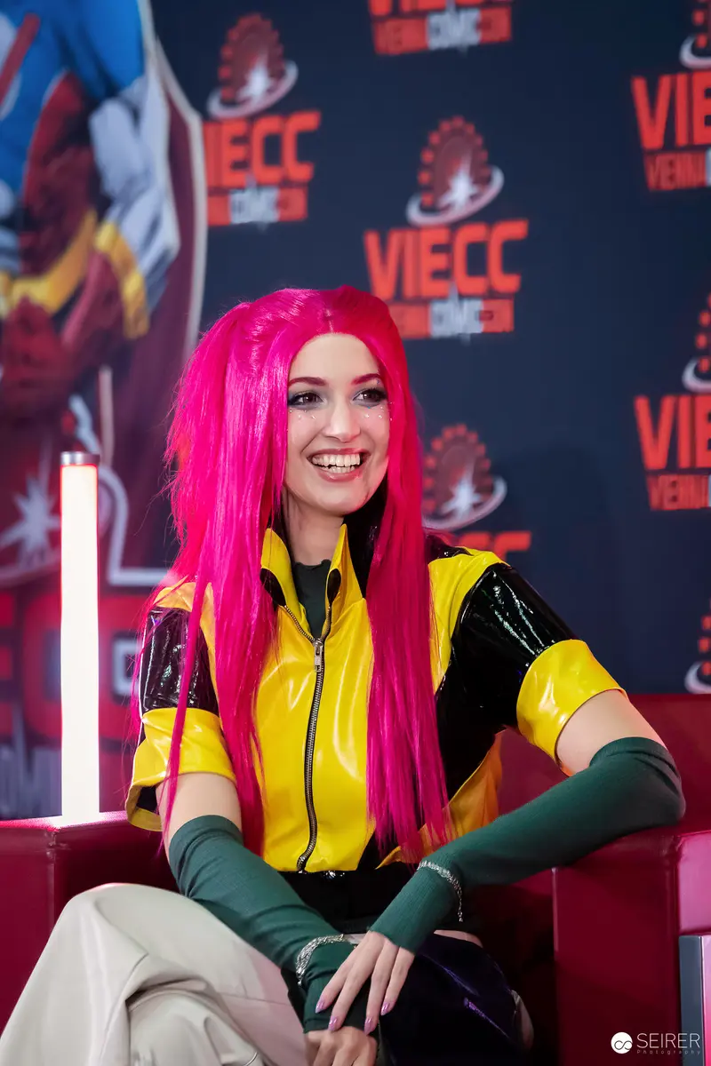 Cosplayer in Pink Wig and Yellow Vinyl Jacket at VIECC Vienna Comic Con 2023