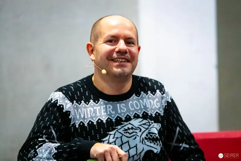 Panel Moderator in "Winter Is Coming" Stark Sweater at Vienna Comic Con 2023