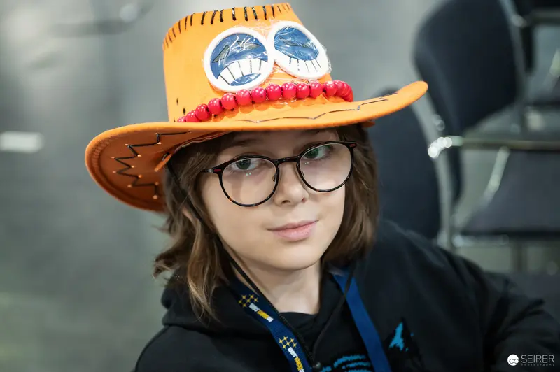 Young One Piece Fan Wearing Portgas D. Ace Cowboy Hat at VIECC Vienna Comic Con 2023